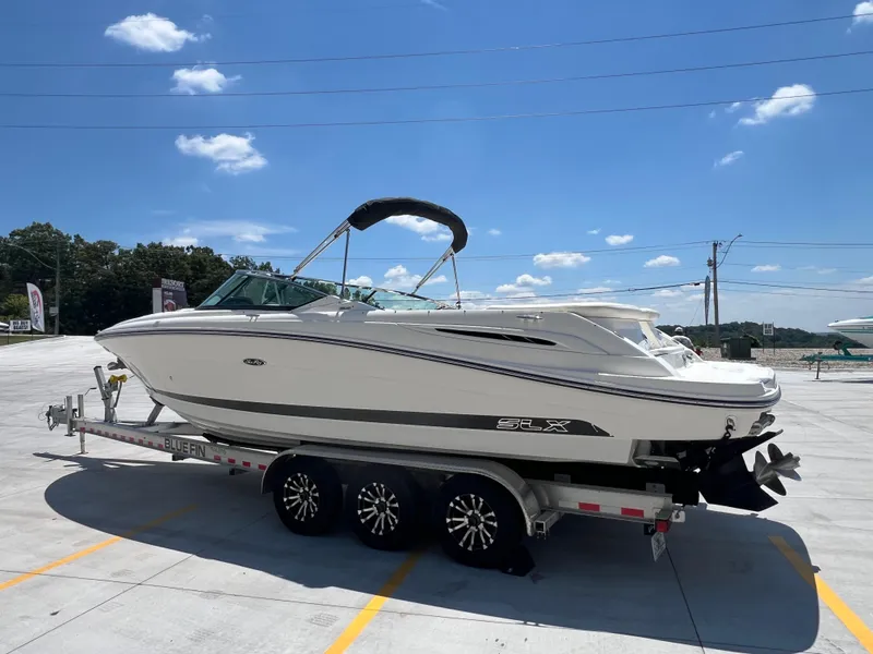 Slide: The Image of 2007 Sea Ray 270 SLX boat on trailer under clear blue sky. - 5
