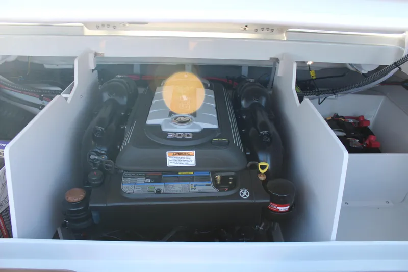 Slide: The Image of 2024 Crownline 240 SS engine compartment with visible components. - 2