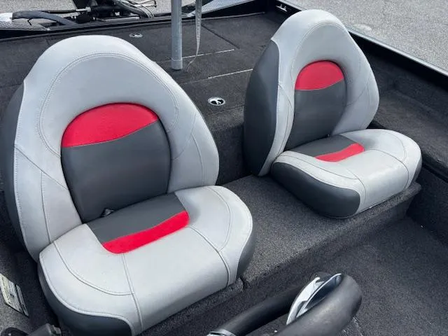 Slide: The Image of 2016 Triton 17 CTX boat interior with gray and red seats. - 7