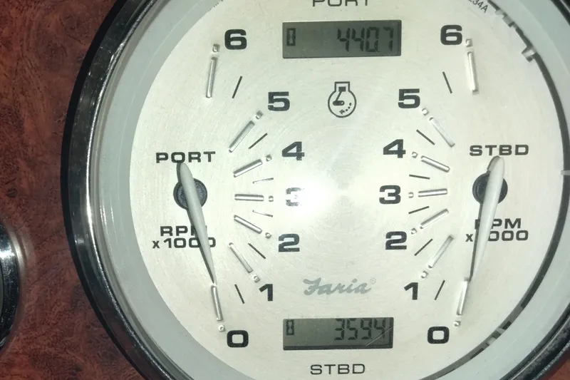 Slide: The Image of Close-up of a 2013 Rinker 310 Express Cruiser tachometer displaying RPM readings. - 19