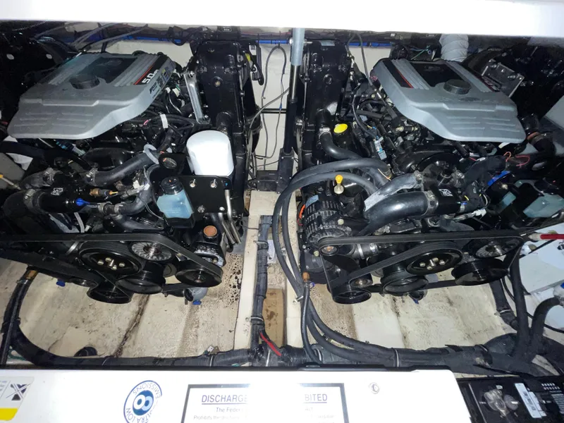 Slide: The Image of Engine compartment of a 2013 Rinker 310 Express Cruiser with dual engines. - 43