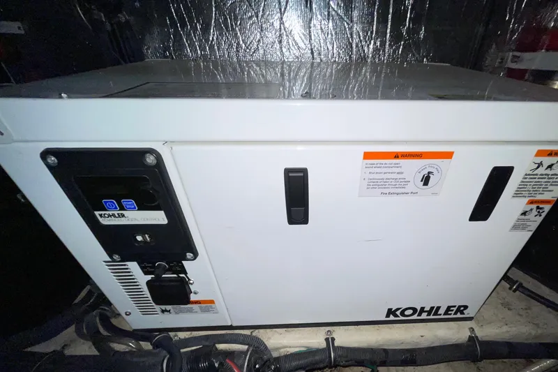 Slide: The Image of Kohler generator in 2013 Rinker 310 Express Cruiser engine room. - 45