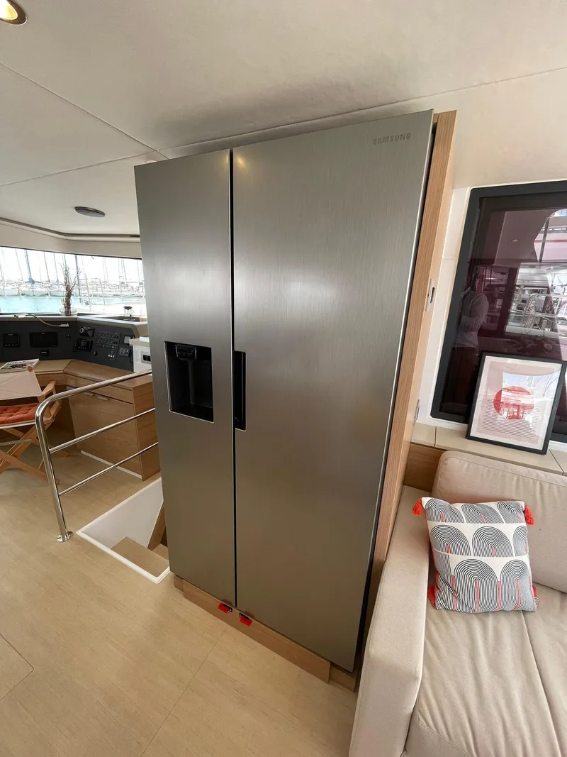 Slide: The Image of Modern kitchen area in a 2026 Bali 4.4 yacht with stainless steel refrigerator. - 10