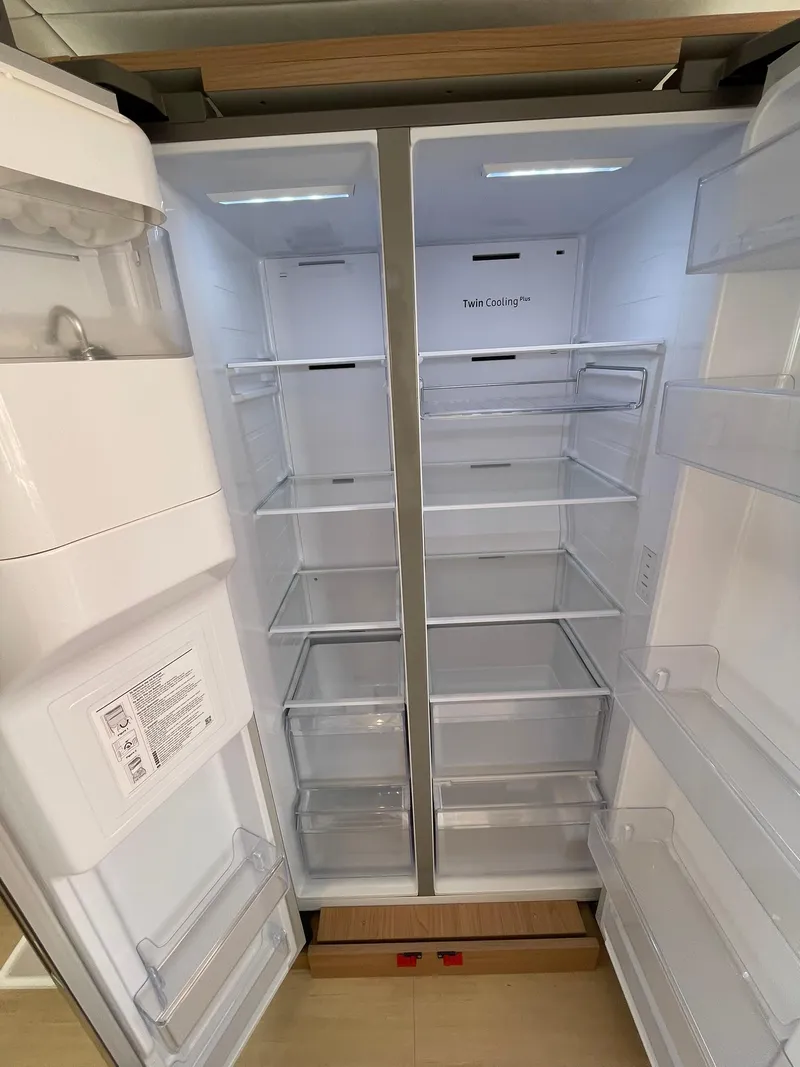 Slide: The Image of Modern Bali 4.4 refrigerator, 2026 model, with spacious interior and adjustable shelves. - 11