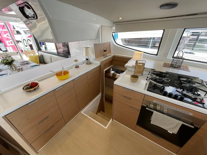 Slide: The Image of Modern kitchen interior on 2026 Bali 4.4 yacht with wooden cabinets and sleek appliances. - 14