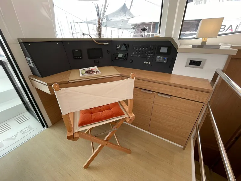 Slide: The Image of Modern yacht interior with wooden desk, control panel, and director's chair, Bali 4.4, 2026 model. - 19