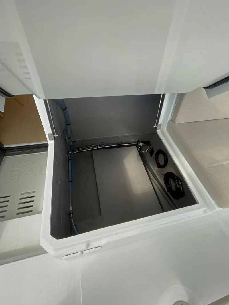 Slide: The Image of Open storage compartment in a 2026 Bali 4.4 model yacht. - 34