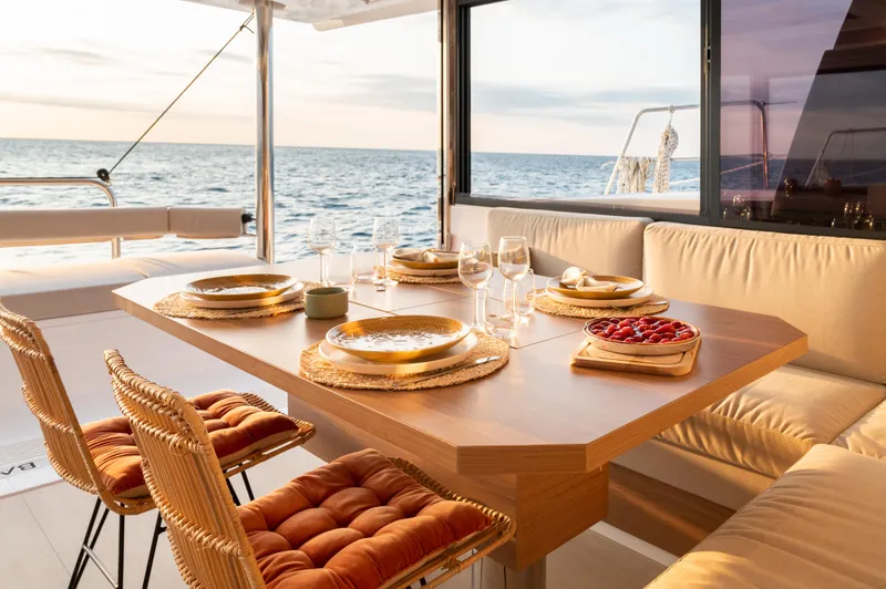 Slide: The Image of Luxurious dining setup on a 2026 Bali 4.4 yacht with ocean view. - 4