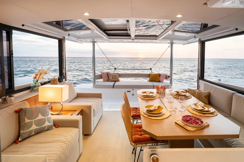 Slide: The Image of Luxurious Bali 4.4 yacht interior with elegant dining area and ocean view, 2026 model. - 5