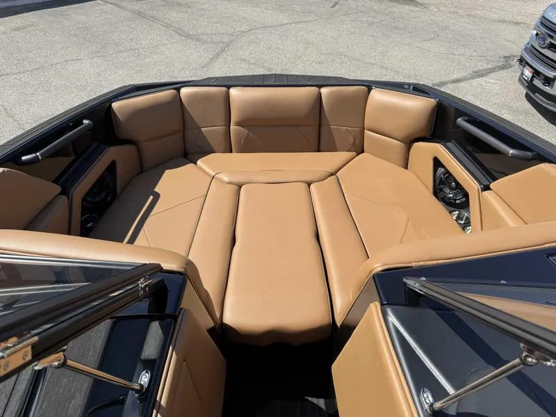 Slide: The Image of 2025 Moomba Tykon boat interior with tan leather seating and modern design. - 3