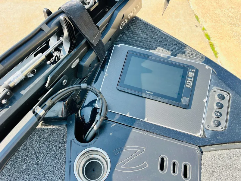 Slide: The Image of 2025 Ranger Z518 Cup-Equipped boat dashboard with Garmin display and control panel. - 15