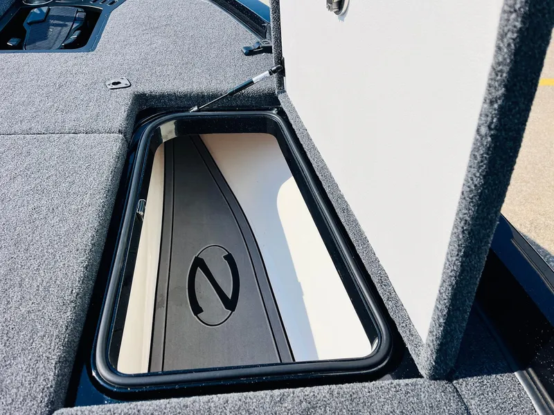 Slide: The Image of 2025 Ranger Z518 Cup-Equipped boat storage compartment with open lid. - 24