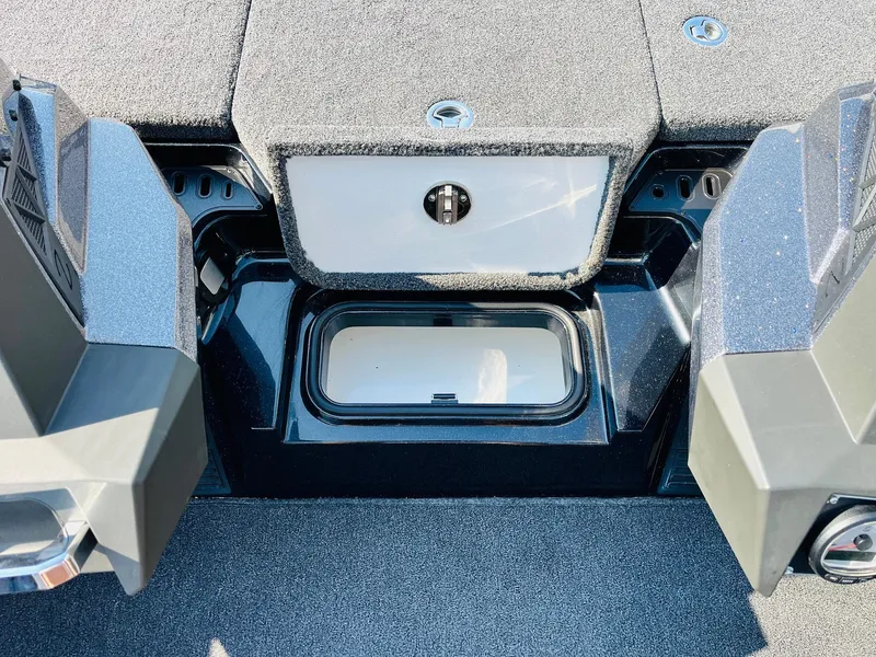Slide: The Image of 2025 Ranger Z518 Cup-Equipped boat interior with storage compartment and sleek design. - 28