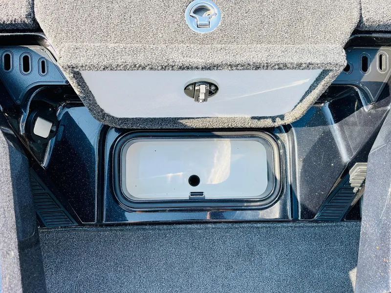 Slide: The Image of Interior storage compartment of 2025 Ranger Z518 Cup-Equipped boat, featuring carpeted finish. - 29