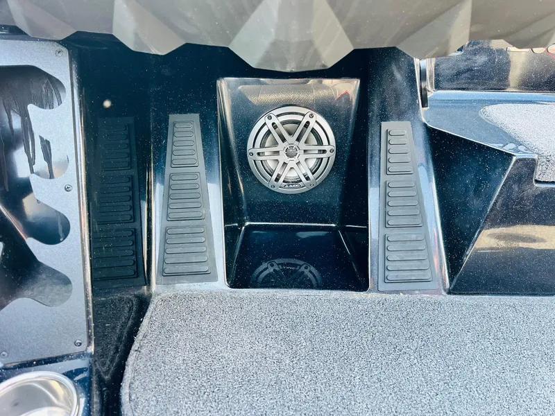 Slide: The Image of 2025 Ranger Z518 Cup-Equipped boat interior with speaker and textured flooring. - 34