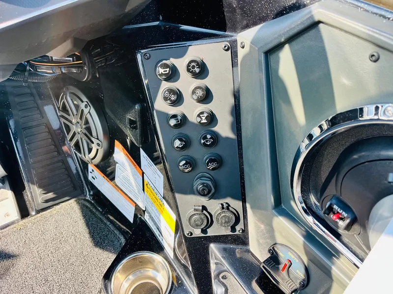 Slide: The Image of Control panel of 2025 Ranger Z518 Cup-Equipped boat with switches and speaker. - 40