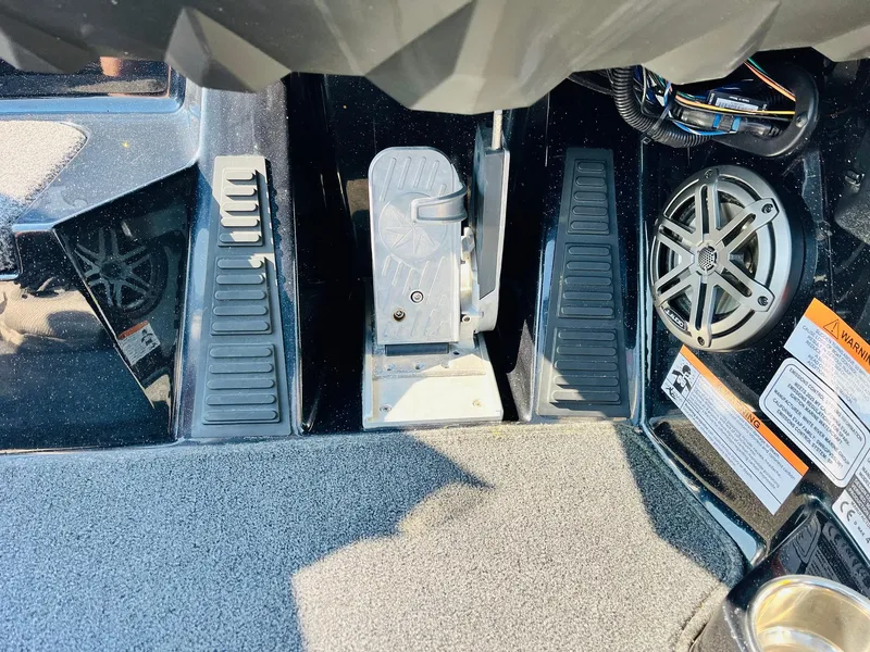 Slide: The Image of 2025 Ranger Z518 Cup-Equipped boat foot pedals and speaker system close-up. - 41