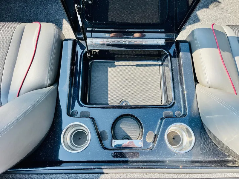 Slide: The Image of 2025 Ranger Z518 Cup-Equipped boat interior with storage compartment and cup holders. - 43