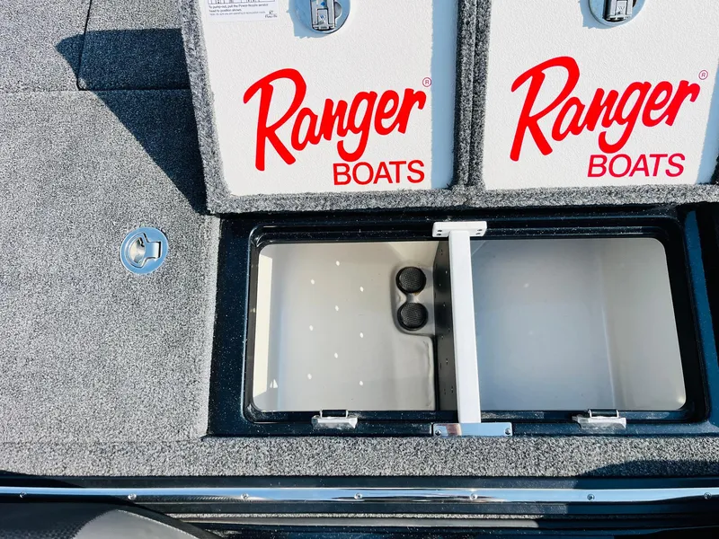 Slide: The Image of 2025 Ranger Z518 Cup-Equipped boat storage compartment with Ranger Boats branding. - 46