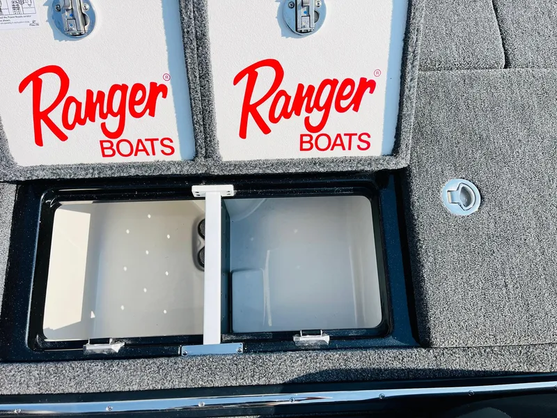 Slide: The Image of 2025 Ranger Z518 Cup-Equipped boat storage compartments with Ranger Boats branding. - 47