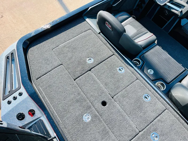 Slide: The Image of 2025 Ranger Z518 Cup-Equipped boat interior with carpeted deck and seating. - 48