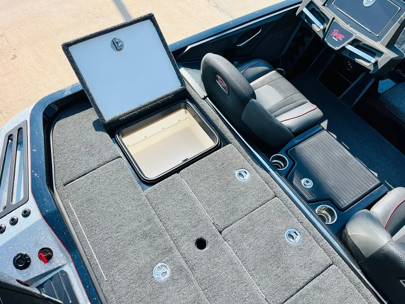 Slide: The Image of 2025 Ranger Z518 Cup-Equipped boat interior with open storage compartment and seating. - 49