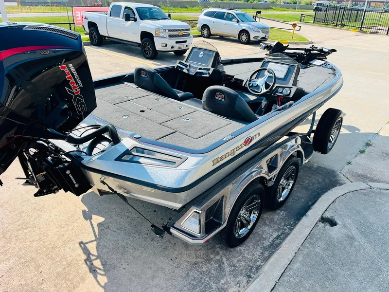 Slide: The Image of 2025 Ranger Z518 Cup-Equipped boat with Mercury Pro XS engine, parked on a trailer. - 5