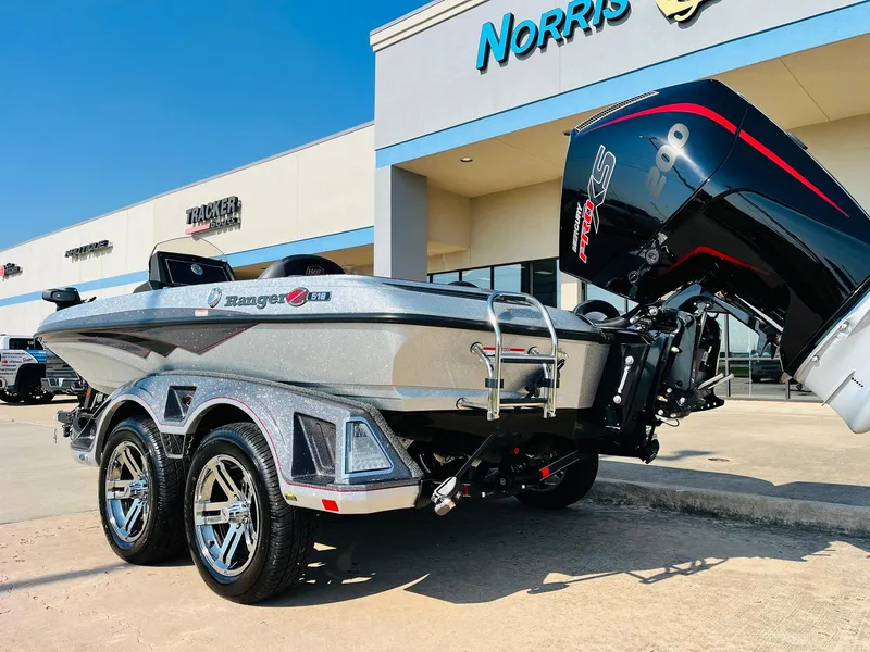 Slide: The Image of 2025 Ranger Z518 Cup-Equipped boat with powerful engine, parked outside dealership. - 8