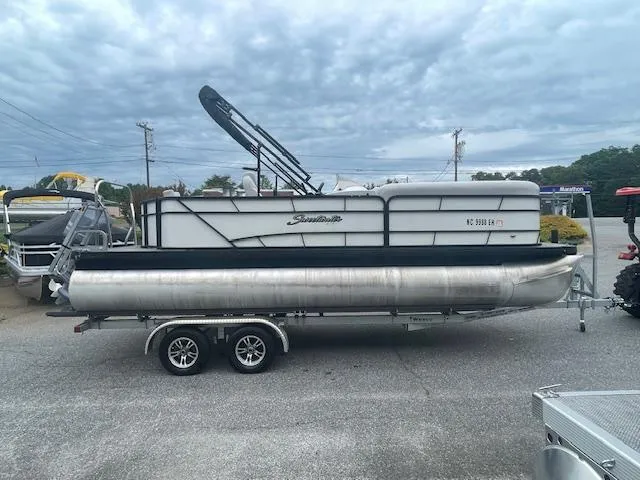 Slide: The Image of 2016 Sweetwater 2286 pontoon boat on a trailer under cloudy skies. - 3