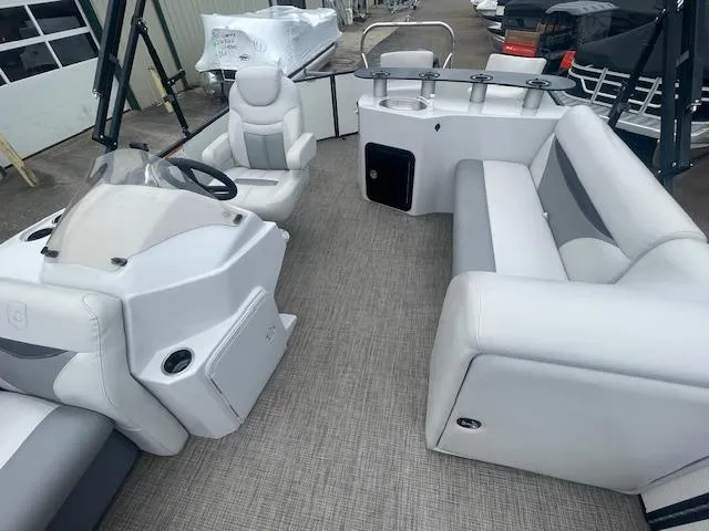 Slide: The Image of Interior of 2016 Sweetwater 2286 boat with seating and steering console. - 5