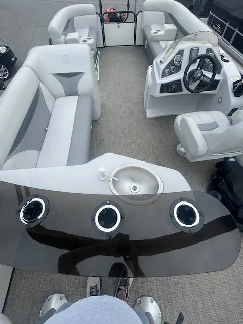 Slide: The Image of Interior of a 2016 Sweetwater 2286 pontoon boat with seating and steering console. - 9