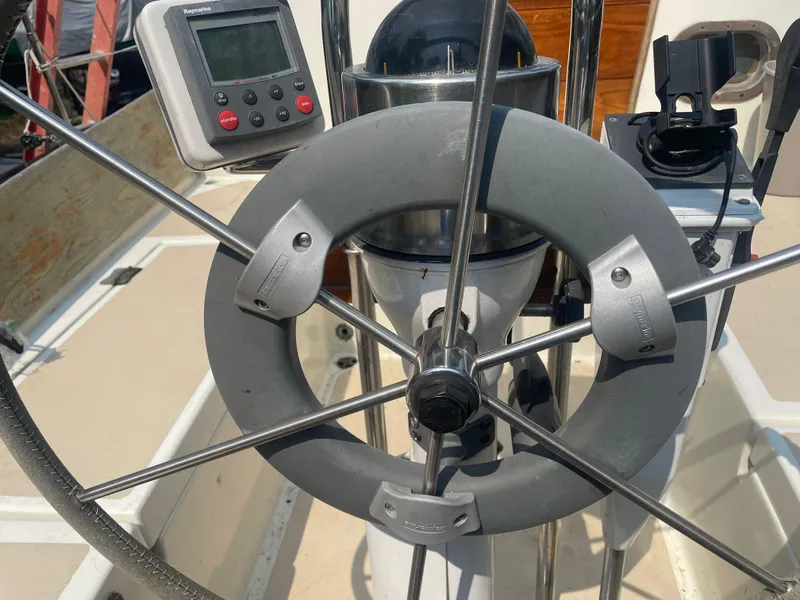 Slide: The Image of Steering wheel and navigation equipment on a 1980 Cape Dory 36 sailboat. - 10