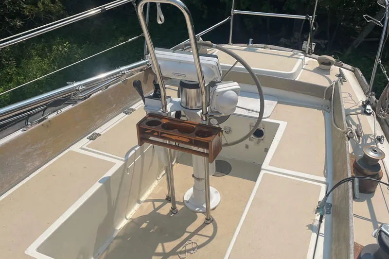 Slide: The Image of Cockpit of 1980 Cape Dory 36 sailboat with steering wheel and navigation equipment. - 15