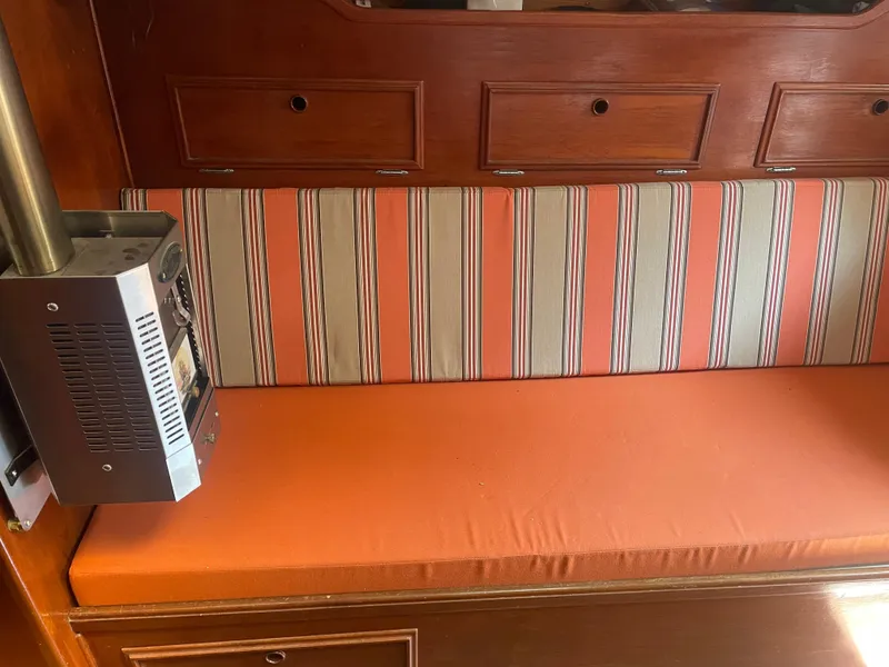 Slide: The Image of Orange-striped seating in 1980 Cape Dory 36 boat interior with wood paneling. - 16