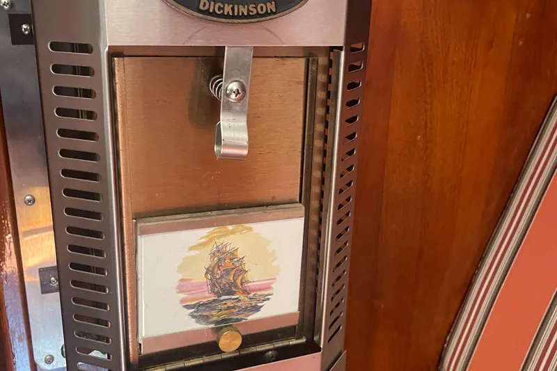 Slide: The Image of Vintage Dickinson heater on 1980 Cape Dory 36 sailboat, featuring nautical artwork. - 23