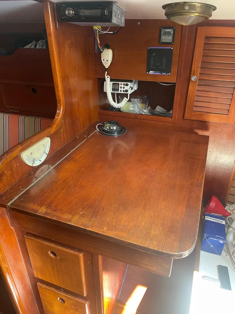 Slide: The Image of 1980 Cape Dory 36 interior with wooden navigation station and communication equipment. - 29