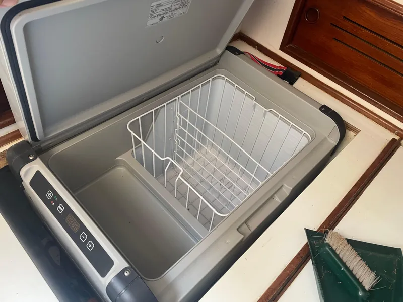 Slide: The Image of Open portable fridge with digital controls on a 1980 Cape Dory 36 boat. - 33