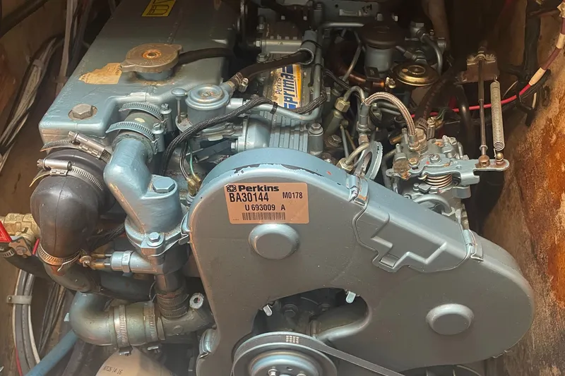 Slide: The Image of Engine of a 1980 Cape Dory 36 sailboat, featuring a Perkins model. - 44