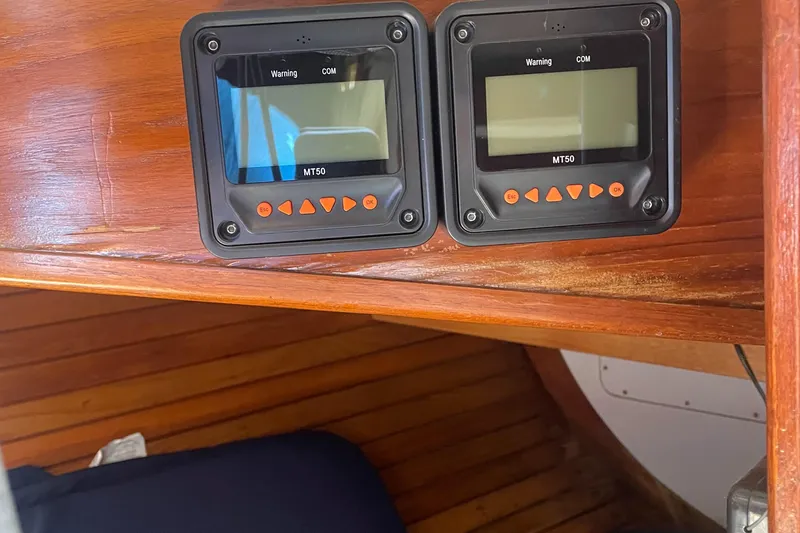 Slide: The Image of Two MT50 control panels on a 1980 Cape Dory 36 wooden interior. - 45
