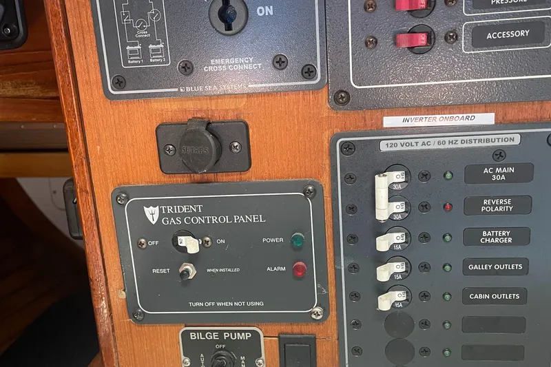 Slide: The Image of Control panel on a 1980 Cape Dory 36 sailboat, featuring gas and electrical systems. - 46