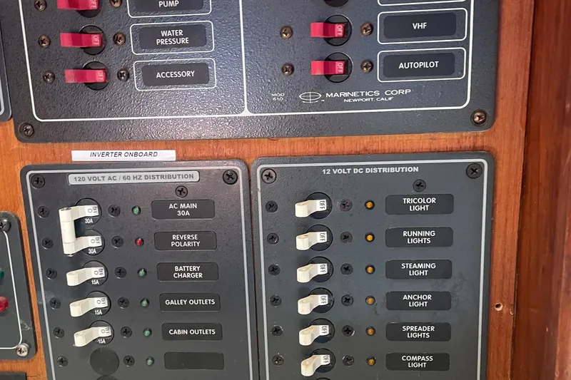 Slide: The Image of Electrical panel on a 1980 Cape Dory 36 sailboat, featuring AC and DC distribution. - 48