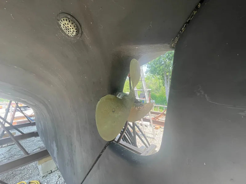 Slide: The Image of Propeller of 1980 Cape Dory 36 sailboat in dry dock, showing hull details. - 5