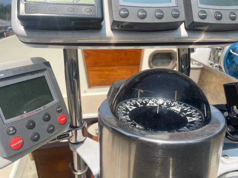Slide: The Image of Compass and navigation instruments on a 1980 Cape Dory 36 sailboat. - 9