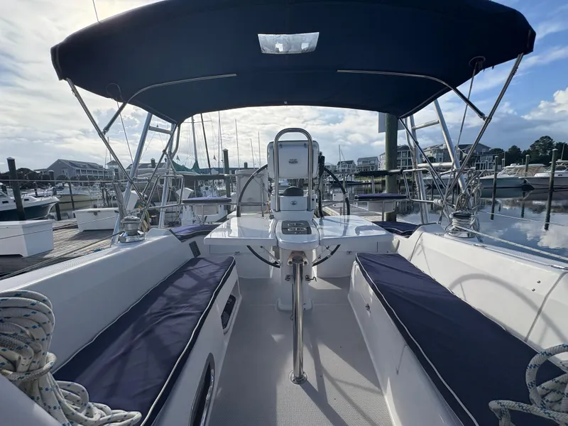 Slide: The Image of 2011 Catalina 355 sailboat cockpit with blue canopy, docked at marina. - 10