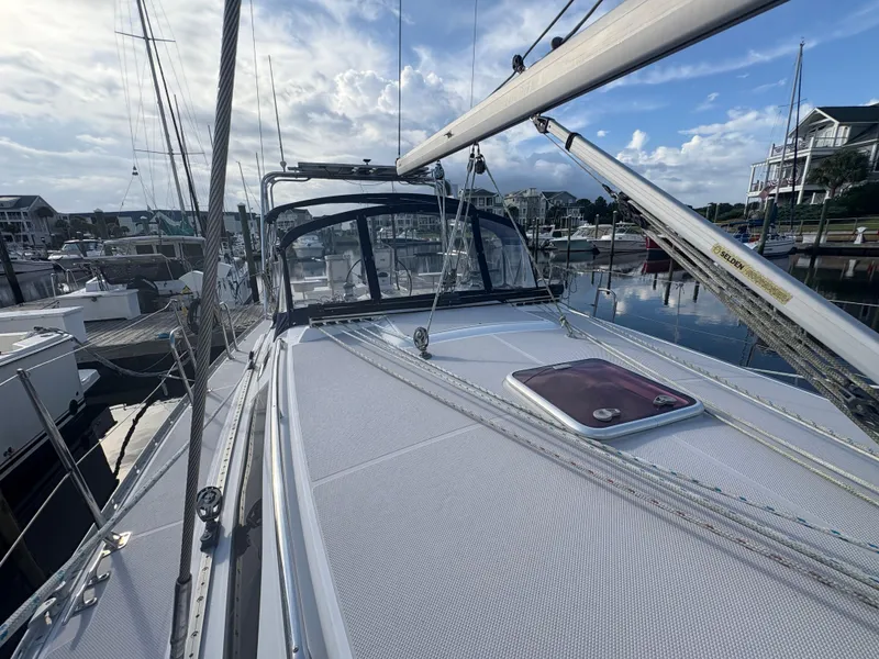 Slide: The Image of Sailboat Catalina 355, 2011 model, docked at marina with clear sky background. - 12