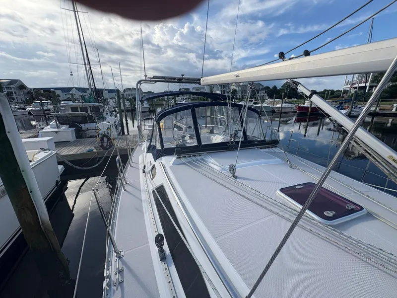Slide: The Image of Sailboat Catalina 355, 2011 model, docked at marina under a partly cloudy sky. - 13