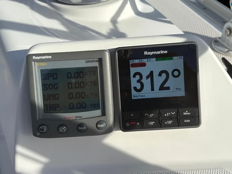 Slide: The Image of Raymarine navigation instruments on a 2011 Catalina 355 sailboat, displaying speed and heading. - 22
