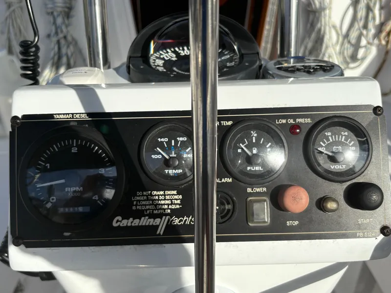 Slide: The Image of Control panel of a 2011 Catalina 355 yacht with gauges and switches. - 24