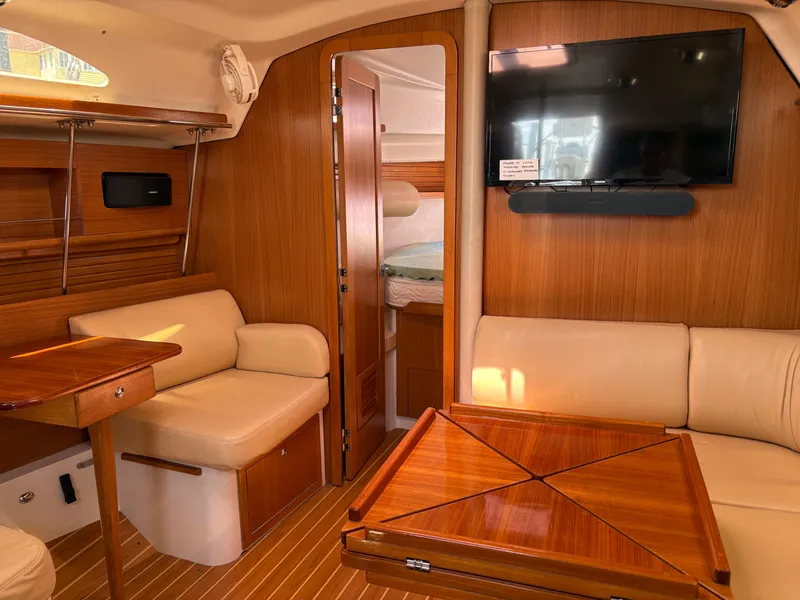Slide: The Image of Interior of 2011 Catalina 355 sailboat with wood finish and comfortable seating. - 29