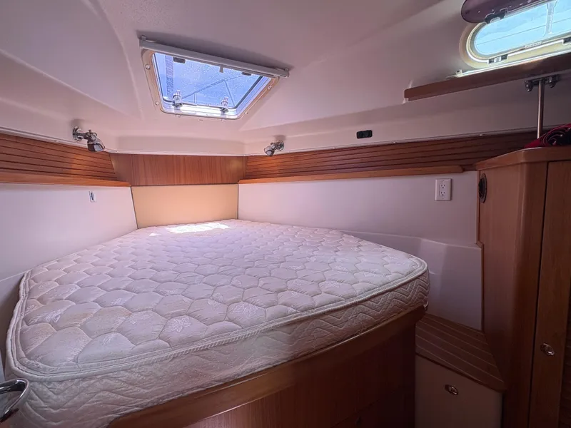 Slide: The Image of Cozy cabin interior of 2011 Catalina 355 sailboat with a comfortable bed. - 30